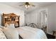 Comfortable bedroom with closet, sliding doors, decorative iron bed frame, and wood floors at 11294 Corsica Mist Ave, Las Vegas, NV 89135