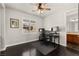 Bedroom with dark wood floors, window shutters and view to vanity area at 11294 Corsica Mist Ave, Las Vegas, NV 89135