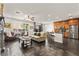Spacious living area featuring an open floor plan to the kitchen with bar stool seating at 11294 Corsica Mist Ave, Las Vegas, NV 89135