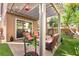 Picturesque outdoor patio area featuring a pergola, brick pavers, landscaping, and seating at 11294 Corsica Mist Ave, Las Vegas, NV 89135