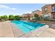 Sparkling community pool with lounge chairs offers a refreshing oasis for residents at 11294 Corsica Mist Ave, Las Vegas, NV 89135