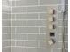 Shower with gray subway tiles and modern fixtures, including push-button controls at 11294 Corsica Mist Ave, Las Vegas, NV 89135
