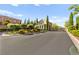 Charming street view of a well-maintained community with lush landscaping at 11294 Corsica Mist Ave, Las Vegas, NV 89135
