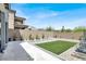 Spacious backyard featuring easy to maintain landscaping, artificial turf, and privacy wall at 12426 Oregon Cherry Ave, Las Vegas, NV 89138