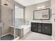 Well-lit bathroom with granite countertops, shower, tub, and dual vanity sinks at 12426 Oregon Cherry Ave, Las Vegas, NV 89138