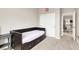 Bedroom showcasing a stylish daybed with storage, closet with sliding doors, and access to the hallway at 12426 Oregon Cherry Ave, Las Vegas, NV 89138
