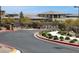 Gated community entrance with lush landscaping and well-maintained street at 12426 Oregon Cherry Ave, Las Vegas, NV 89138