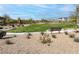 Community park area features green grass, benches, and walking paths at 12426 Oregon Cherry Ave, Las Vegas, NV 89138