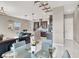 Open-concept layout connecting dining to kitchen, featuring modern fixtures and natural light at 12426 Oregon Cherry Ave, Las Vegas, NV 89138