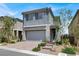 Charming two-story home with landscaped yard and a two-car garage, offering curb appeal at 12426 Oregon Cherry Ave, Las Vegas, NV 89138