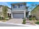 Charming two-story home with landscaped yard and a two-car garage, offering curb appeal at 12426 Oregon Cherry Ave, Las Vegas, NV 89138