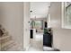 Bright foyer with tile flooring, leading to an open-concept kitchen and living area with natural light at 12426 Oregon Cherry Ave, Las Vegas, NV 89138