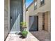 Inviting front door with a charming walkway and mature landscaping, enhancing curb appeal at 12426 Oregon Cherry Ave, Las Vegas, NV 89138