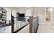 Bright hallway with neutral walls, iron and wood banister, and access to the other rooms at 12426 Oregon Cherry Ave, Las Vegas, NV 89138