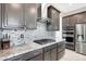 Updated kitchen featuring granite countertops, stainless steel appliances, and designer backsplash at 12426 Oregon Cherry Ave, Las Vegas, NV 89138
