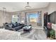 Open-concept living room with modern decor, stylish furniture, and ample natural light at 12426 Oregon Cherry Ave, Las Vegas, NV 89138