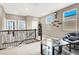 Bright loft area with railing, glass table, and comfortable seating space at 12426 Oregon Cherry Ave, Las Vegas, NV 89138