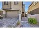 Charming home exterior showcasing a private front entrance and paved driveway at 12532 Blissful Sky St, Las Vegas, NV 89138
