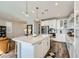 Bright kitchen with white cabinets, a large island with seating, and stainless steel appliances at 12532 Blissful Sky St, Las Vegas, NV 89138
