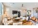 Comfortable living room with plush seating, a ceiling fan, and abundant natural light at 12532 Blissful Sky St, Las Vegas, NV 89138