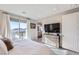 Inviting bedroom boasts bright light from the sliding glass doors, neutral paint and mountain views at 12532 Blissful Sky St, Las Vegas, NV 89138