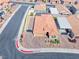 Stunning aerial view of home featuring desert landscaping, clay tile roof, and spacious driveway at 1319 Yosemite St, Boulder City, NV 89005