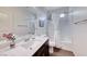 Bright bathroom with marble countertop, a shower-tub combination, and modern fixtures at 1319 Yosemite St, Boulder City, NV 89005