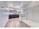 Modern bathroom with glass shower, double vanity, and wood-look tile at 1319 Yosemite St, Boulder City, NV 89005