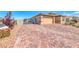 Expansive brick-paved driveway leading to a two-car garage and gated side entrance at 1319 Yosemite St, Boulder City, NV 89005