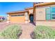 Charming single-story home featuring a two-car garage, desert landscaping, and a stylish entryway at 1319 Yosemite St, Boulder City, NV 89005