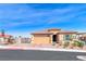 Charming single-story home with a well-manicured front yard and a brick-paved driveway at 1319 Yosemite St, Boulder City, NV 89005