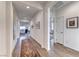 Bright hallway with wood-look flooring and neutral paint, leading to living areas at 1319 Yosemite St, Boulder City, NV 89005
