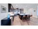 Modern kitchen features dark wood cabinets, stainless steel appliances, and a large island with seating at 1319 Yosemite St, Boulder City, NV 89005