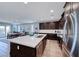 Modern kitchen with a large island with seating, stainless steel appliances, and ample counter space at 1319 Yosemite St, Boulder City, NV 89005