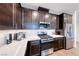 Modern kitchen featuring stainless steel appliances, gas range, and sleek countertops at 1319 Yosemite St, Boulder City, NV 89005