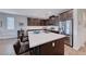 Modern kitchen with stainless steel appliances, a center island with barstool seating and ample cabinet space at 1319 Yosemite St, Boulder City, NV 89005