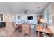 Bright living room featuring a ceiling fan, mounted television, and stylish furniture at 1319 Yosemite St, Boulder City, NV 89005