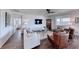 Bright living room with modern furnishings, wood-look floors, and a ceiling fan at 1319 Yosemite St, Boulder City, NV 89005