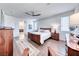 Spacious main bedroom with wood-look tile, ceiling fan, and ample natural light at 1319 Yosemite St, Boulder City, NV 89005