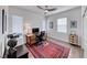Inviting home office with wood desk, ceiling fan, and bright natural light at 1319 Yosemite St, Boulder City, NV 89005