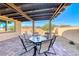 Covered patio features a dining set, creating an inviting outdoor dining space at 1319 Yosemite St, Boulder City, NV 89005