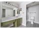Bathroom with green cabinets and a shower-tub combo at 1400 Jamielinn Ln # 104, Las Vegas, NV 89110