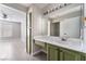 Bright bathroom featuring green cabinets and direct access to the bedroom at 1400 Jamielinn Ln # 104, Las Vegas, NV 89110