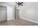 Open bedroom with closet, ceiling fan, and wood-look flooring at 1400 Jamielinn Ln # 104, Las Vegas, NV 89110