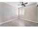 Bright bedroom with window and light wood-look flooring at 1400 Jamielinn Ln # 104, Las Vegas, NV 89110