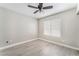 Bedroom featuring wood-look floors, neutral walls, and a bright window at 1400 Jamielinn Ln # 104, Las Vegas, NV 89110
