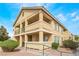 Spacious two-story apartment building features private balconies, desert landscaping, and ample natural light at 1400 Jamielinn Ln # 104, Las Vegas, NV 89110