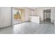 Open living room with tile floor and sliding glass door to balcony at 1400 Jamielinn Ln # 104, Las Vegas, NV 89110