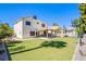Large backyard featuring artificial grass, a patio, and a play area at 1508 Silver Knoll Ave, Las Vegas, NV 89123