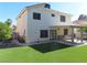 This home boasts a well-manicured backyard with synthetic lawn and covered patio at 1508 Silver Knoll Ave, Las Vegas, NV 89123